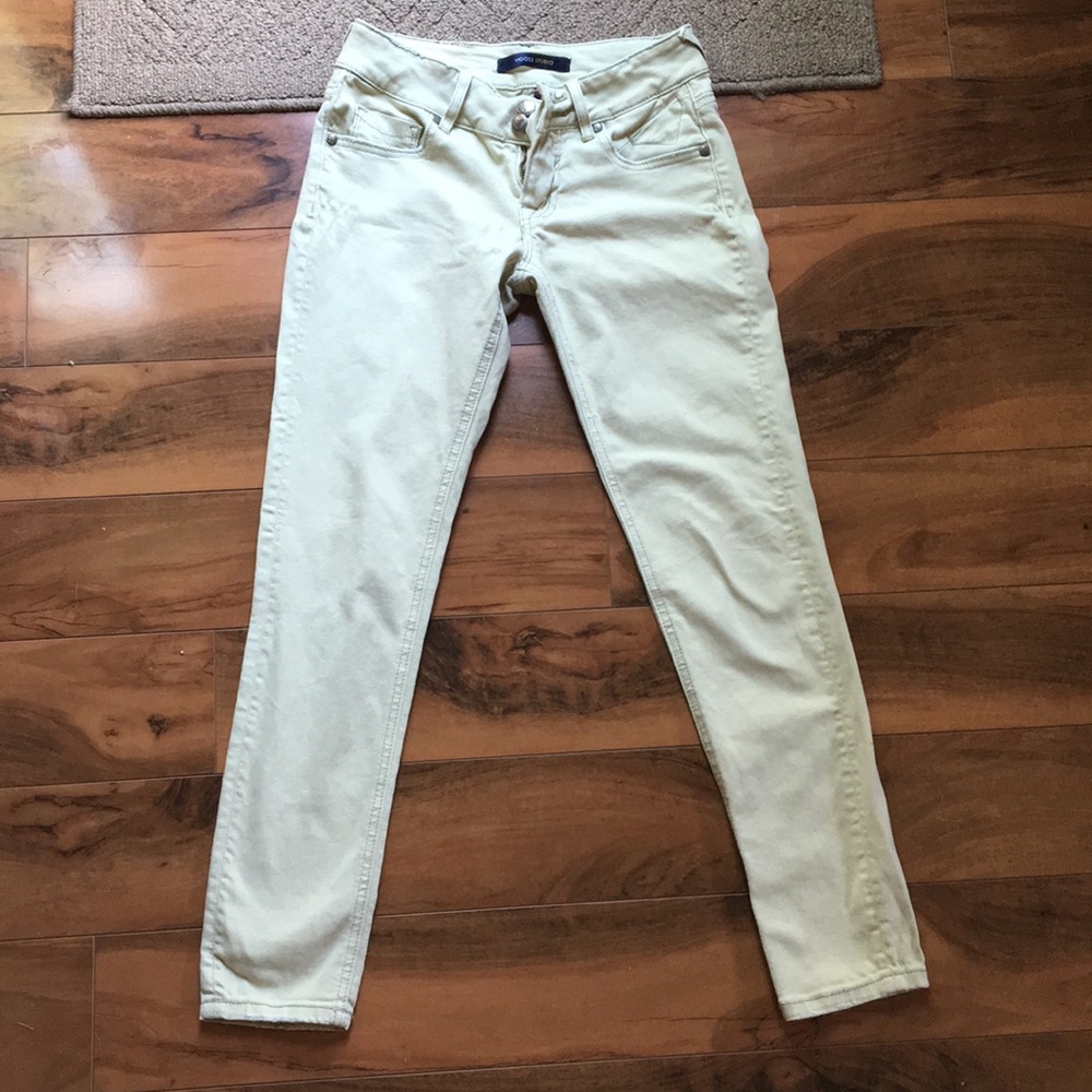 Green colored jean pants